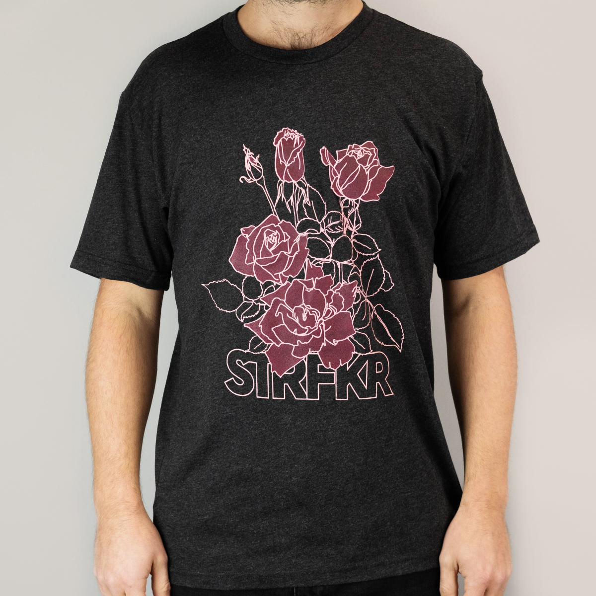 black shirt with pink roses